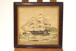 An early 19th century woolwork picture, 'British Man of War at sail',