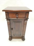 A Continental pot cupboard with one drawer above a panelled door on bun feet,