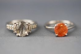 A selection of two dress rings each set with varieties of quartz.