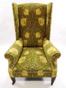 A 19th century wing armchair, newly upholstered, in William Morris design fabric,