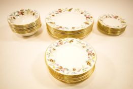 A Minton porcelain eight setting part dinner service,