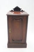 A late Victorian mahogany pot cupboard, of rectangular form,