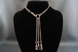 A white metal curb link chatelaine necklace having three drops to front