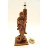 A carved Chinese carved hardwood figure table lamp, circa 1920,