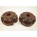 A pair of 19th century mahogany lotus form capitals or stands,