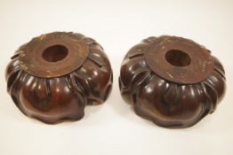 A pair of 19th century mahogany lotus form capitals or stands,