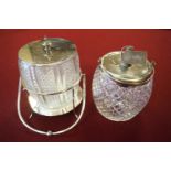 Two electroplated mounted glass biscuit barrels together with a teapot and hot water jug