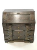 A 19th century stained pine Continental bureau with fall front above three shaped drawers,
