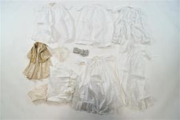 A collection of children's linen to include five cotton lace/Broderie Anglaise gowns and a fur