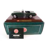 A boxed Corgi limited edition 1:18 scale MGB Roadster in green,