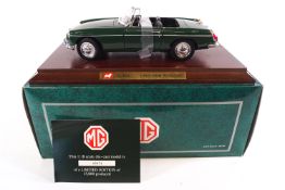 A boxed Corgi limited edition 1:18 scale MGB Roadster in green,