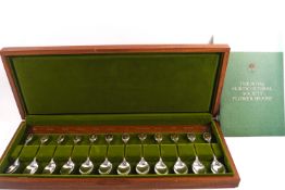 A cased set of silver and gilt teaspoons, The Royal Horticultural Society flower spoons,