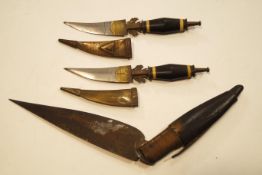 A Middle Eastern lock knife with horn handle and a pair of knives in horn scabbards (3)