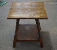 A Victorian mahogany occasional table on turned legs linked by an under tier on square feet,