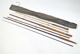 A group of fishing rods to include a 264 cm two section rod