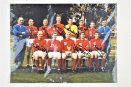 A 1966 England team photo signed by eight players (all with C.O.