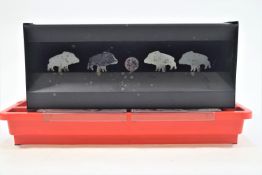 A metal air rifle box target with four boards of wild boar silhouettes