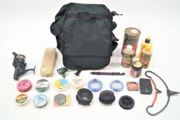 A coarse fishing rucksack and contents, reel,