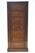 A six gun cabinet with internal safe, clad in mahogany to look like a 19th century semainier,