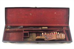 A period leather rigid rectangular gun case with brass mounted corners and lock,