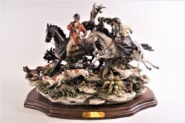 A Capodimonte figure group 'Fox Hunt' (Cacia alla Volpe), on titled stand,