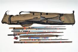 A rod holdall with umbrella and a quantity of assorted rods