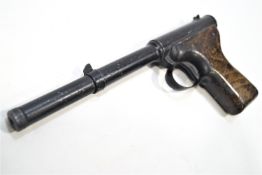 An early Diana air pistol with wooden grip, push in barrel action and two tins of pellets,