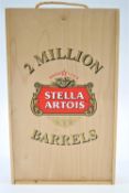 A wooden cased celebration Limited edition bottle of Stella Artois, no 00746 and two flute glasses,