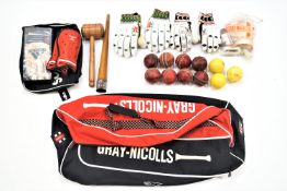 Two sports bags of assorted cricket and other equipment, to include men's and junior's cricket pads,