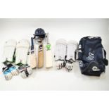A cricket set, including three bats, three pairs of gloves, two sets of pads,