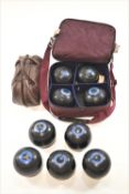 A bag of seven lawn bowls and a pair of bowls and Jacquelite by Jacques of London and others