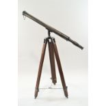 A brass cased field telescope, apparently un-marked, with pull off lens cover, 99cm high,