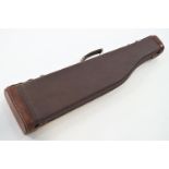 A contemporary composition and leather gun case,