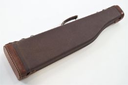 A contemporary composition and leather gun case,