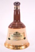 A Wade stoneware Bells whisky flagon in the form of a handbell, 25cm high,