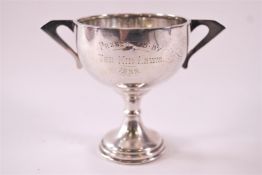 Sporting Interest - A silver two handled trophy with hemispherical bowl on a baluster stem with