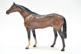 A Beswick chestnut race horse with attached tail 29 cm