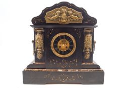 A Victorian slate and marble mantel clock, the enamel dial with visible anchor escapement,