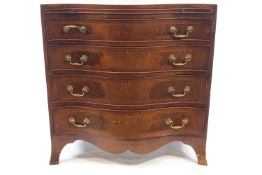 A mahogany serpentine chest of drawers with brushing slide above four drawers,