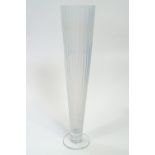 A large opalescent glass vase, of ribbed trumpet form, raised on a clear glass plain foot,