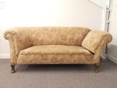An early 20h century two seater drop end Club style sofa, raised on mahogany cabriole legs,