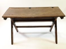 A child's 19th century oak folding double desk, on "A" frame,