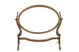 A mahogany framed oval swing frame mirror,