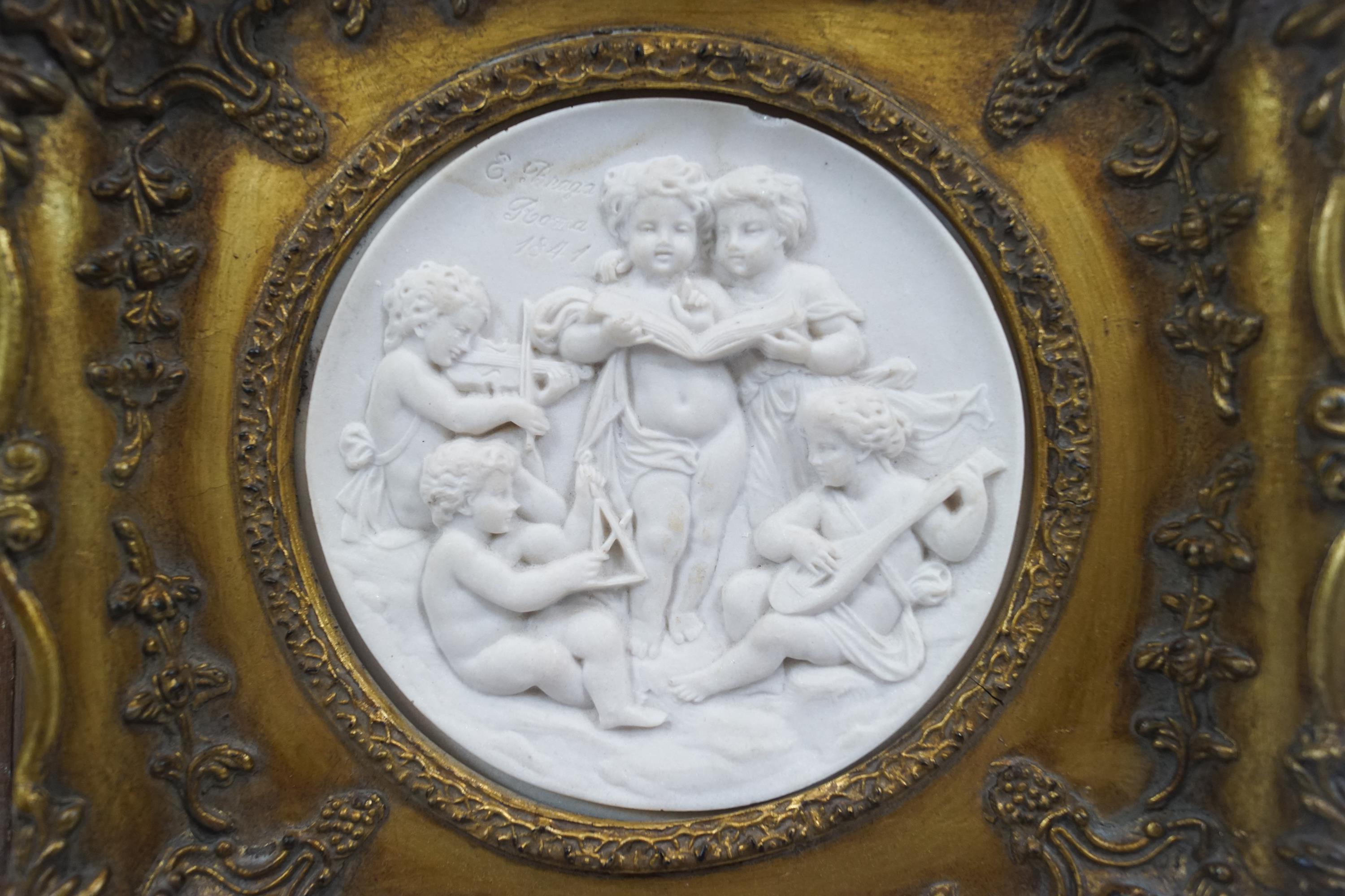 A gilt framed composition tondo of putti musicians, - Image 2 of 2