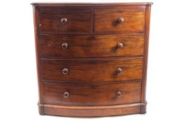 A Victorian mahogany chest of two short and three long drawers, with turned handles,