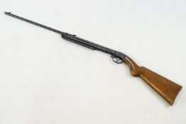 A vintage air rifle, with shaped oak butt, unmarked,