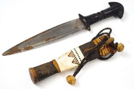 A Housa Arm dagger, in a leather sheath,