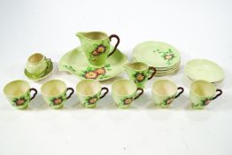 A Carlton ware tea service comprising six cups and saucers, six tea plates, two jugs,