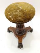 A Victorian walnut piano stool, on waisted triform base with carved scroll feet,