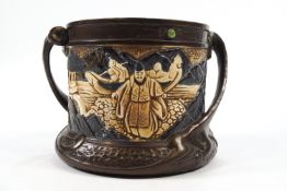 A Bretby two handled jardiniere, the frieze inset with cabochons,